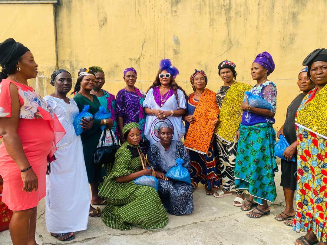 Great Mind Achievers leader with community beneficiaries